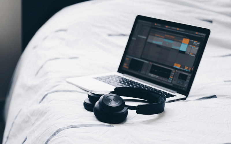 ableton-on-laptop-on-bed-with-headphones